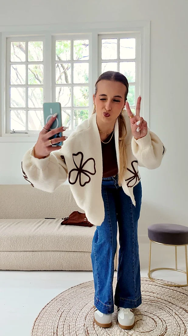 Novex team member filming content on her phone